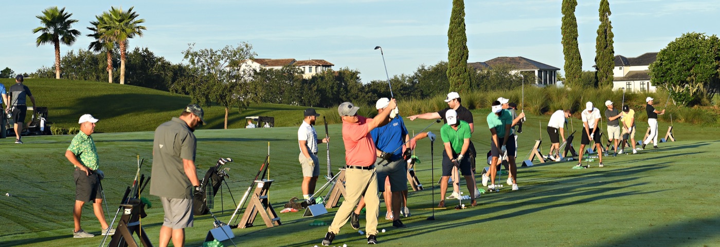 A full tee line of golfers at a club tournament